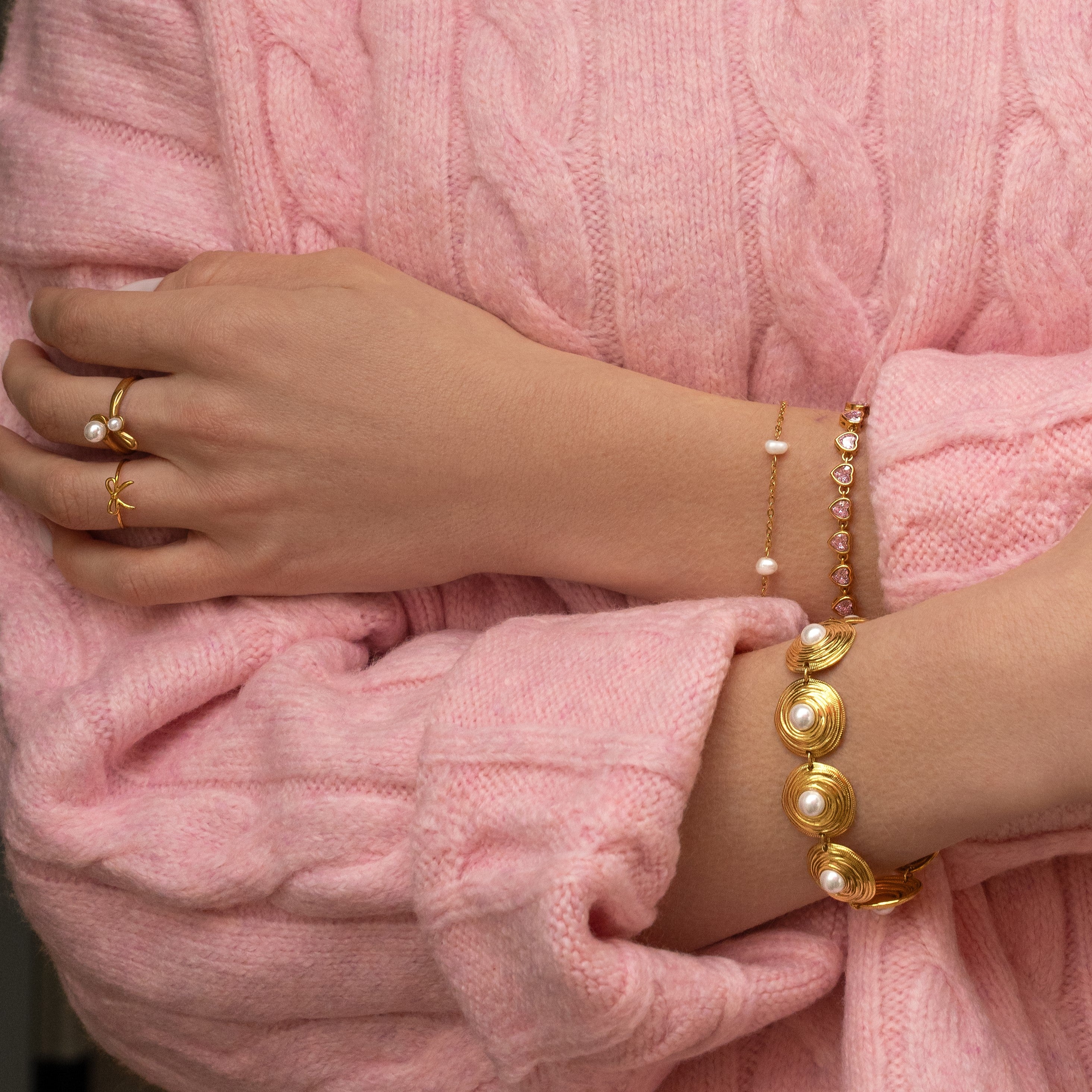 Ring hugging pearls